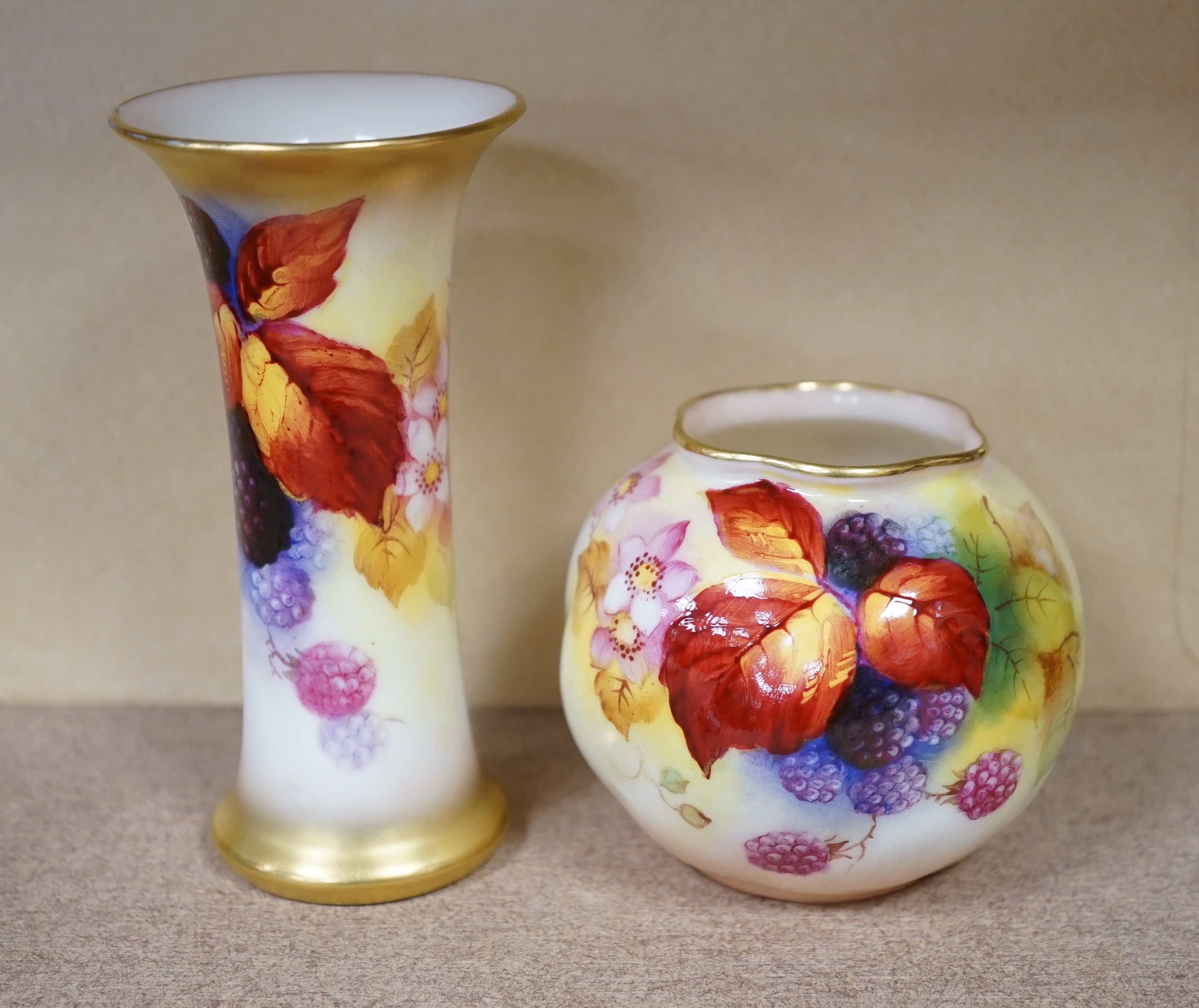 A Royal Worcester spill vase fruit painted with berries by Kitty Blake and a small bowl by the same artist, largest 11.5cm high. Condition - good